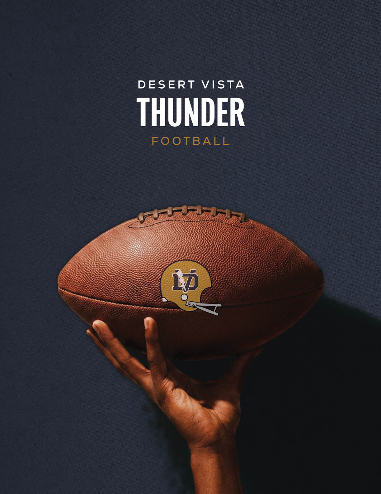 A hand is holding a football with a Desert Vista Thunder logo against a dark background with the words Desert Vista Thunder Football above it. Description generated by AI