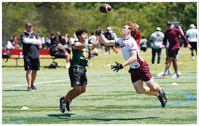 A football player wearing a blue and red jersey. Description generated by AI
