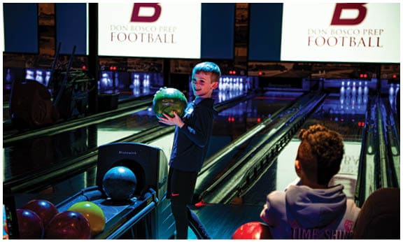 A football player wearing a blue and red jersey. Description generated by AI