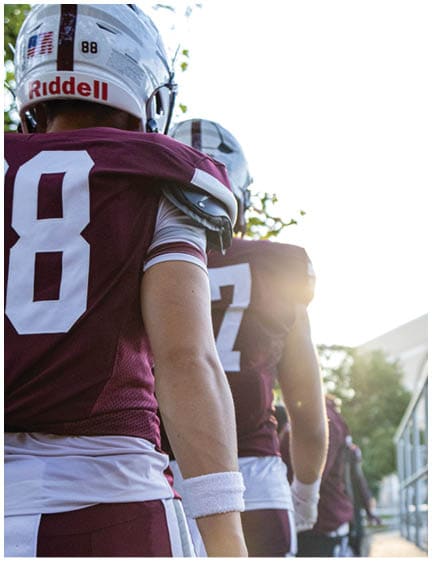 A football player wearing a blue jersey with the number 58 on it. Description generated by AI