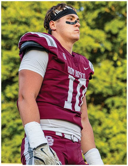 A football player wearing a blue jersey with the number 58 on it. Description generated by AI