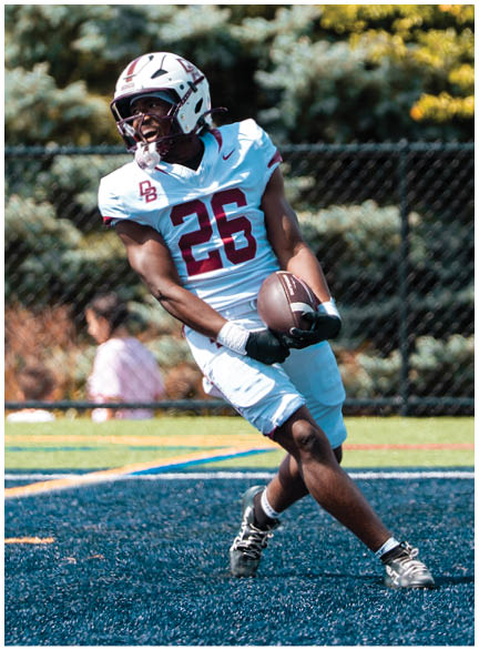A football player wearing a blue jersey with the number 58 on it. Description generated by AI