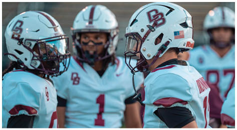 A football player wearing a blue and red jersey. Description generated by AI