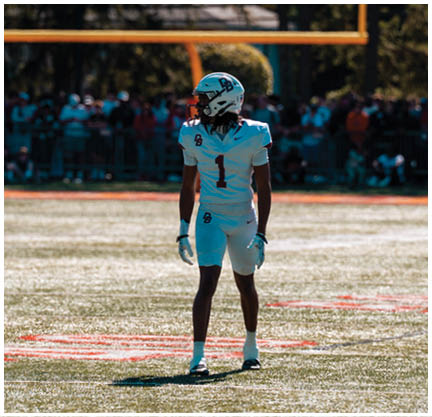 A football player running on the field. Description generated by AI