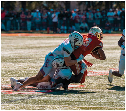 A football player running on the field. Description generated by AI