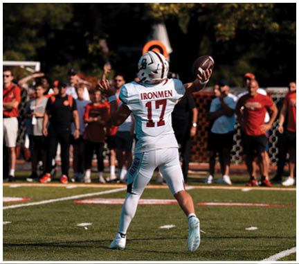 A football player running on the field. Description generated by AI