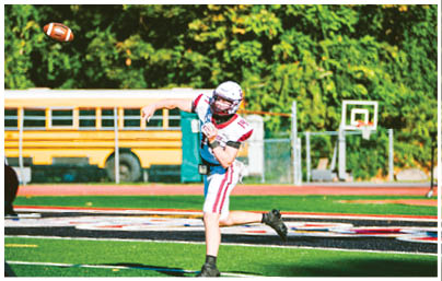A football player wearing a blue and red jersey. Description generated by AI