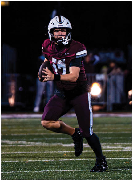 A football player wearing a blue jersey with the number 58 on it. Description generated by AI
