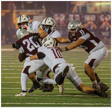 A football player running on the field. Description generated by AI