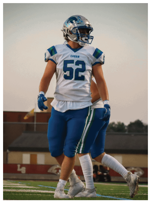 Two football players wearing black jerseys and holding hands. Description generated by AI