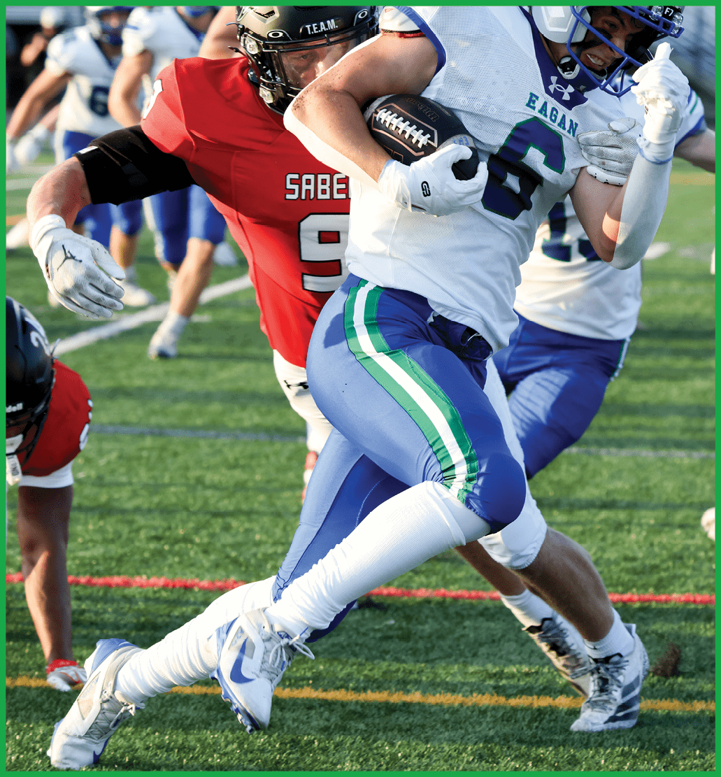A football player running on the field. Description generated by AI