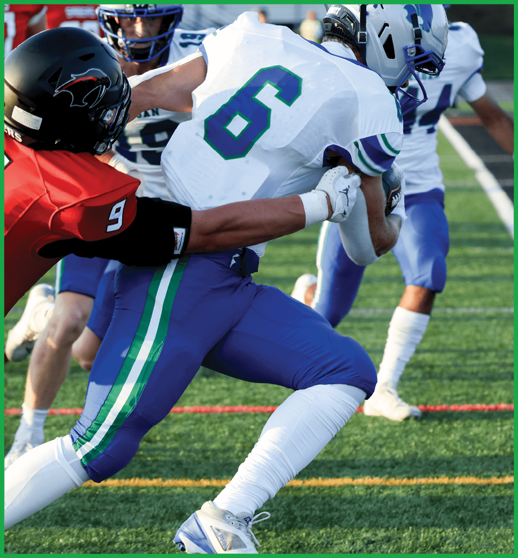 A football player running on the field. Description generated by AI