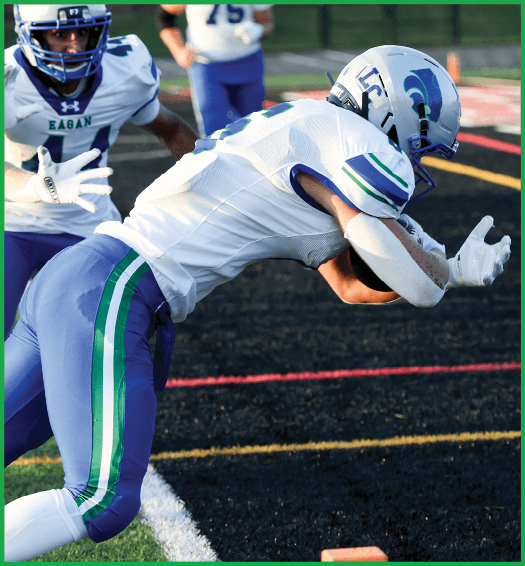 A football player running on the field. Description generated by AI