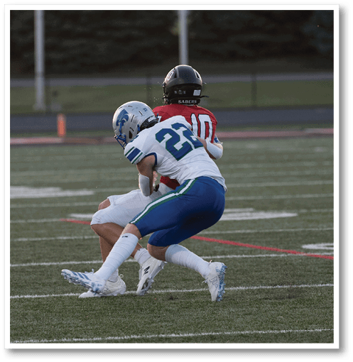 Two football players wearing black jerseys with the number 11 on them. Description generated by AI