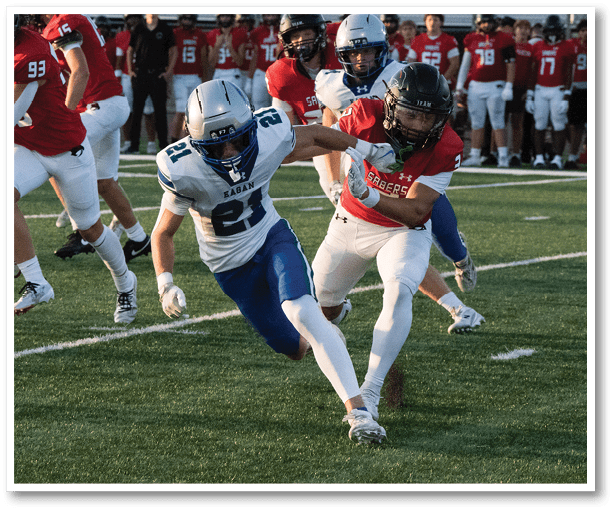 A football player is kicking a football on a field. Description generated by AI