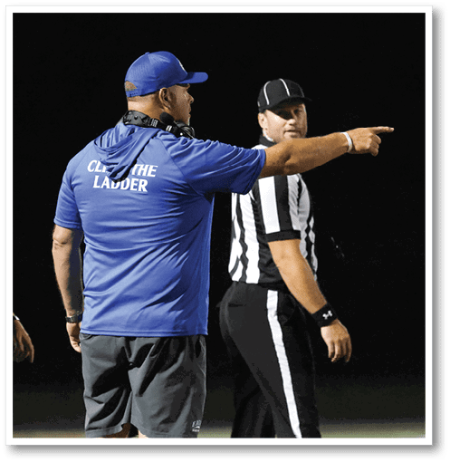 A group of men wearing black and white jerseys. Description generated by AI
