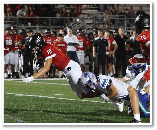 A football player is kicking a football on a field. Description generated by AI
