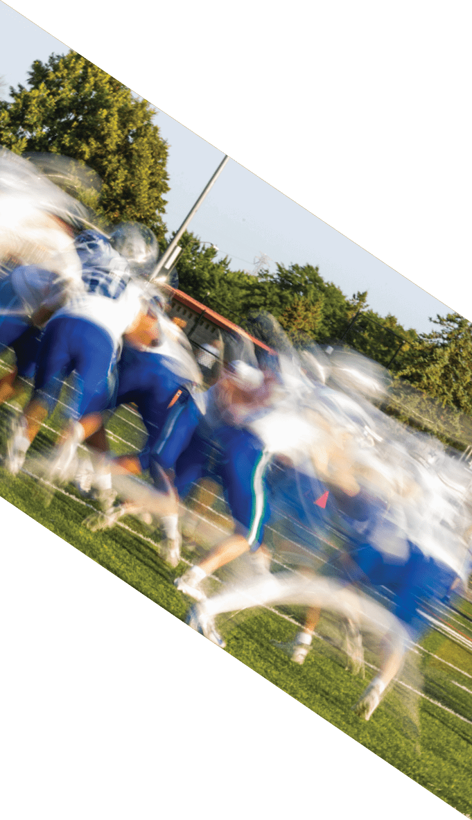A football team is gathered around a coach, listening to his instructions. AI generated content