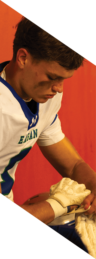 Two young men wearing football uniforms and making hand gestures. AI generated content