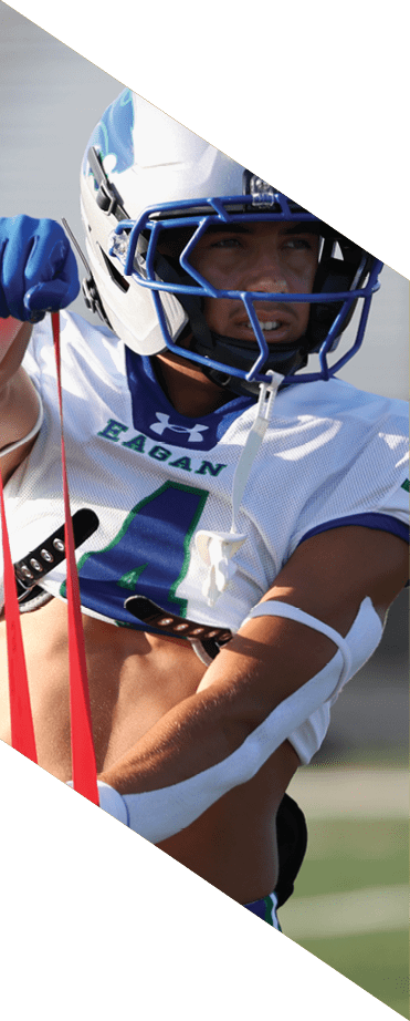 A football player wearing a white jersey with the number 86 catches a football in the air. AI generated content