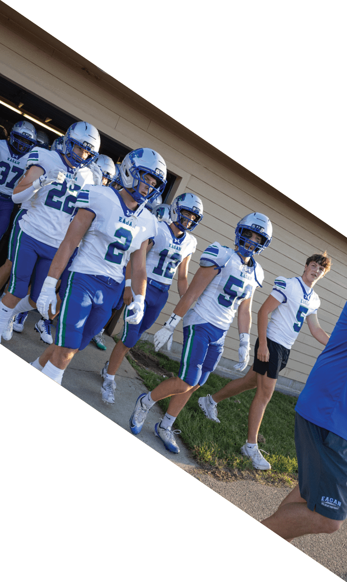 Three men wearing football uniforms are posing for a picture. AI generated content