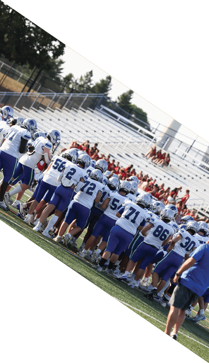 A football team is gathered around a coach, listening to his instructions. AI generated content