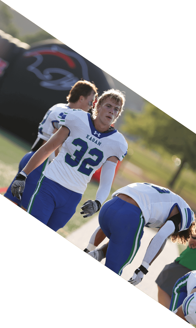 A group of football players pose for a picture. AI generated content