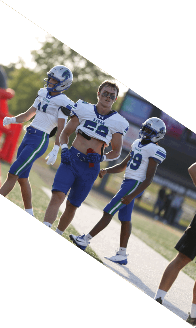Three men wearing football uniforms are posing for a picture. AI generated content
