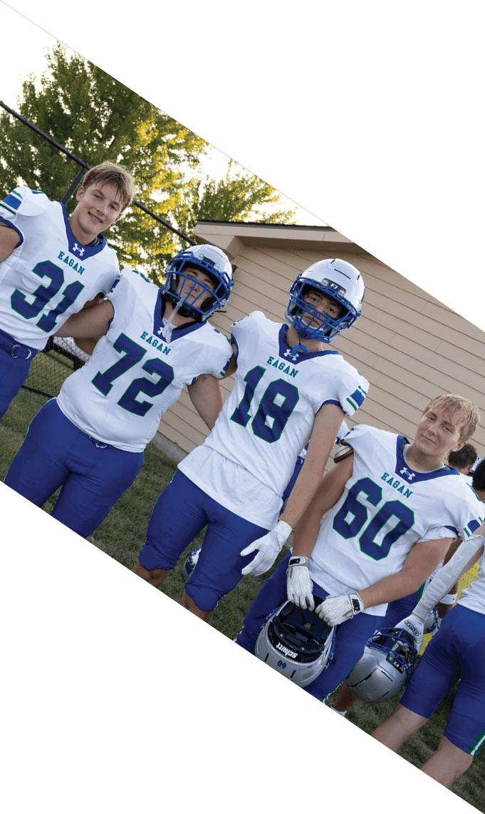 A group of football players pose for a picture. AI generated content