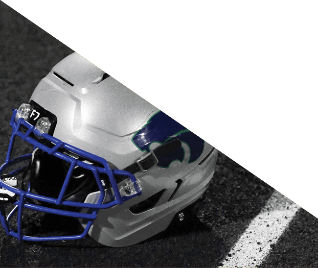 A group of football players kneeling on the field, some with their hands on their heads. AI generated content