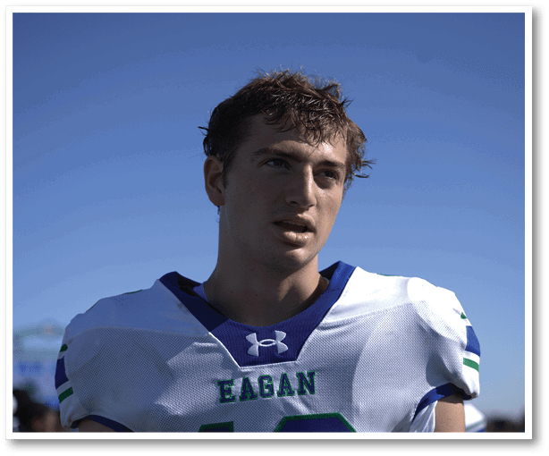 A group of football players wearing black jerseys with the number 3 on them. Description generated by AI