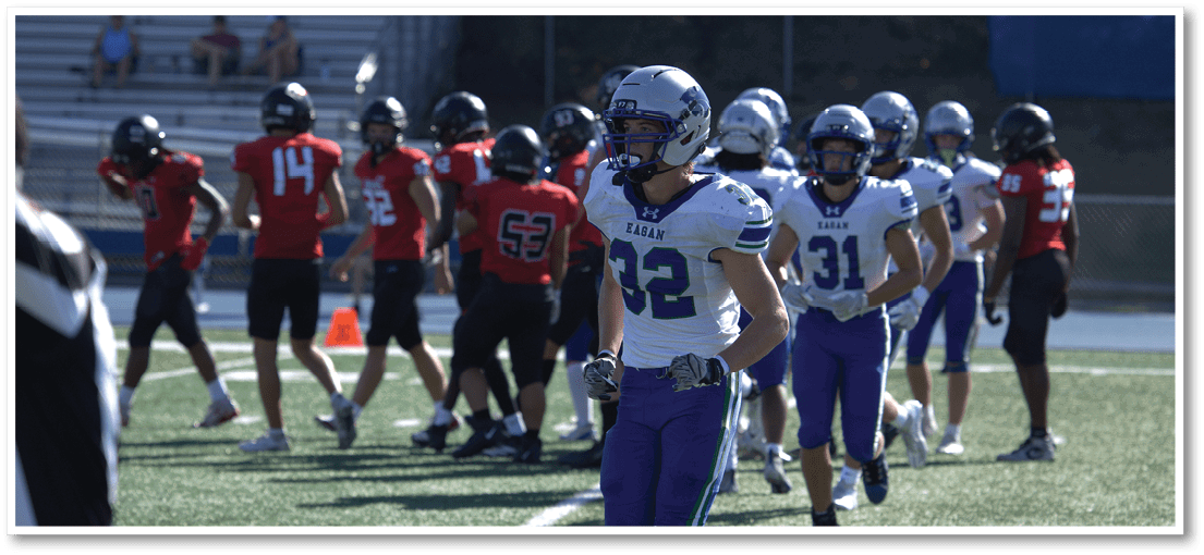 A football player running on the field. Description generated by AI