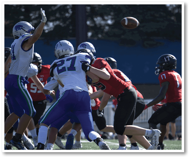 A group of football players wearing black jerseys with the number 3 on them. Description generated by AI