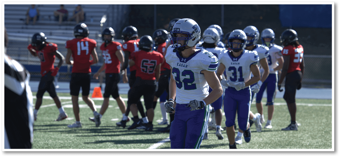 A football player running on the field. Description generated by AI