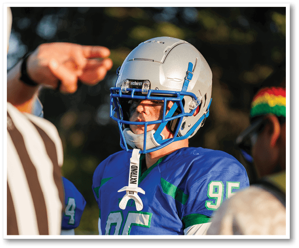 A group of football players wearing black jerseys with the number 3 on them. Description generated by AI