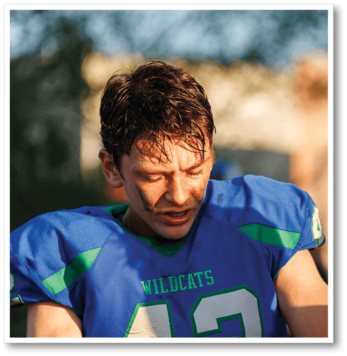 Two football players wearing black jerseys with the number 11 on them. Description generated by AI