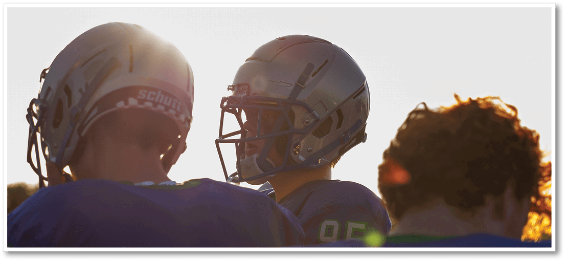 A football player running on the field. Description generated by AI