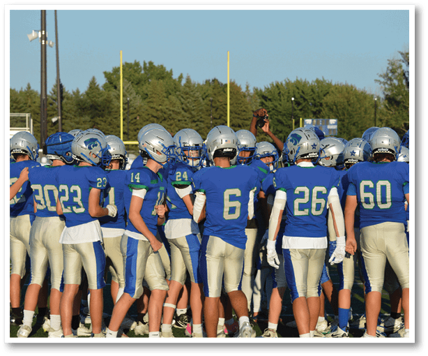 A group of football players wearing black jerseys with the number 3 on them. Description generated by AI