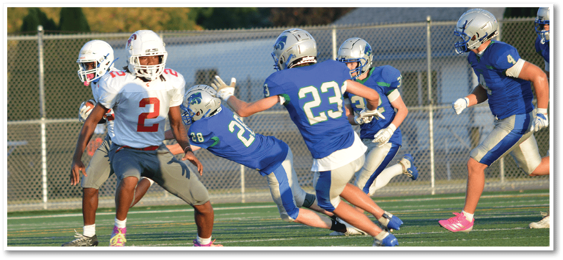 A football player running on the field. Description generated by AI