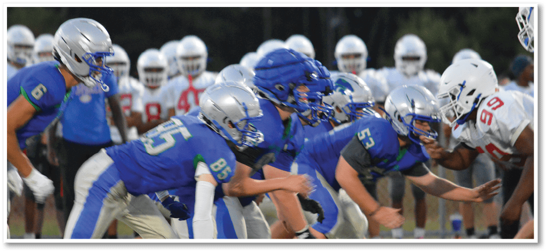 A football player running on the field. Description generated by AI