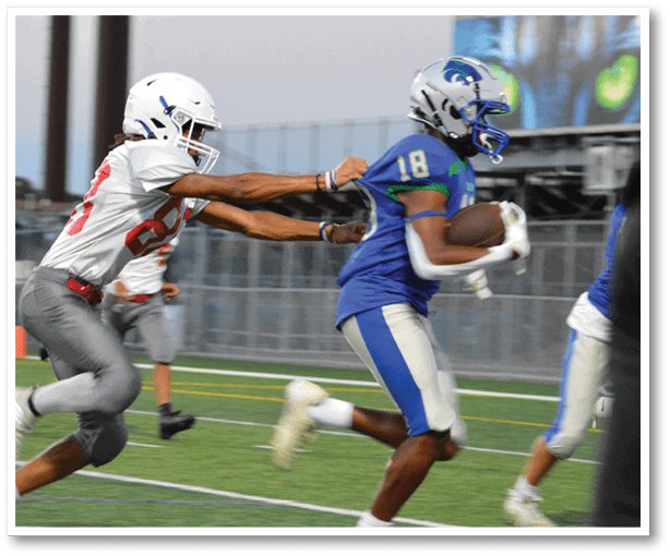 A football player is kicking a football on a field. Description generated by AI