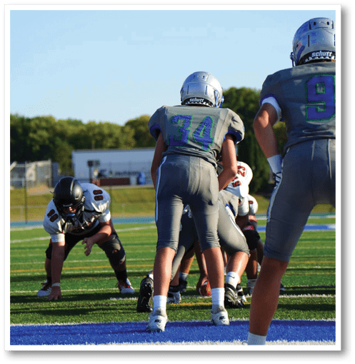 Two football players wearing black jerseys with the number 11 on them. Description generated by AI