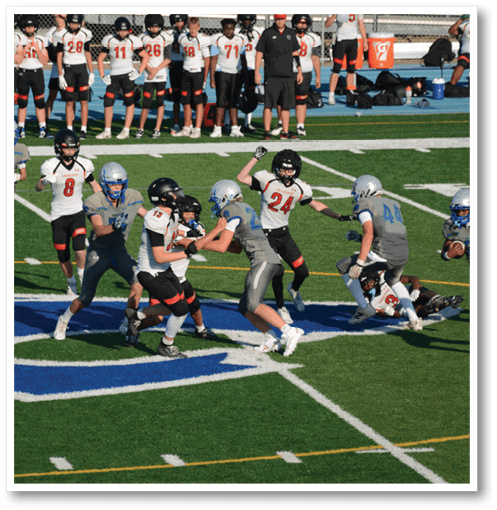 A group of men wearing black and white jerseys. Description generated by AI