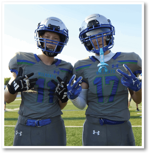 A group of men wearing black and white jerseys. Description generated by AI