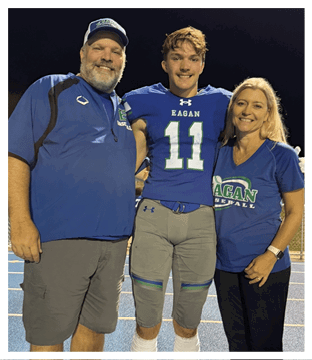 A football player wearing a blue and red jersey. Description generated by AI