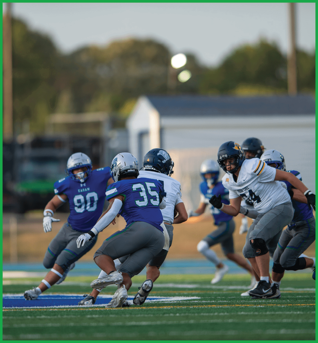 A football player in a white jersey with the number 16 on it. Description generated by AI