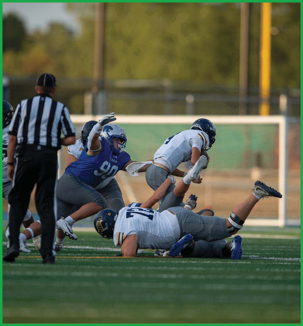 A football player running on the field. Description generated by AI
