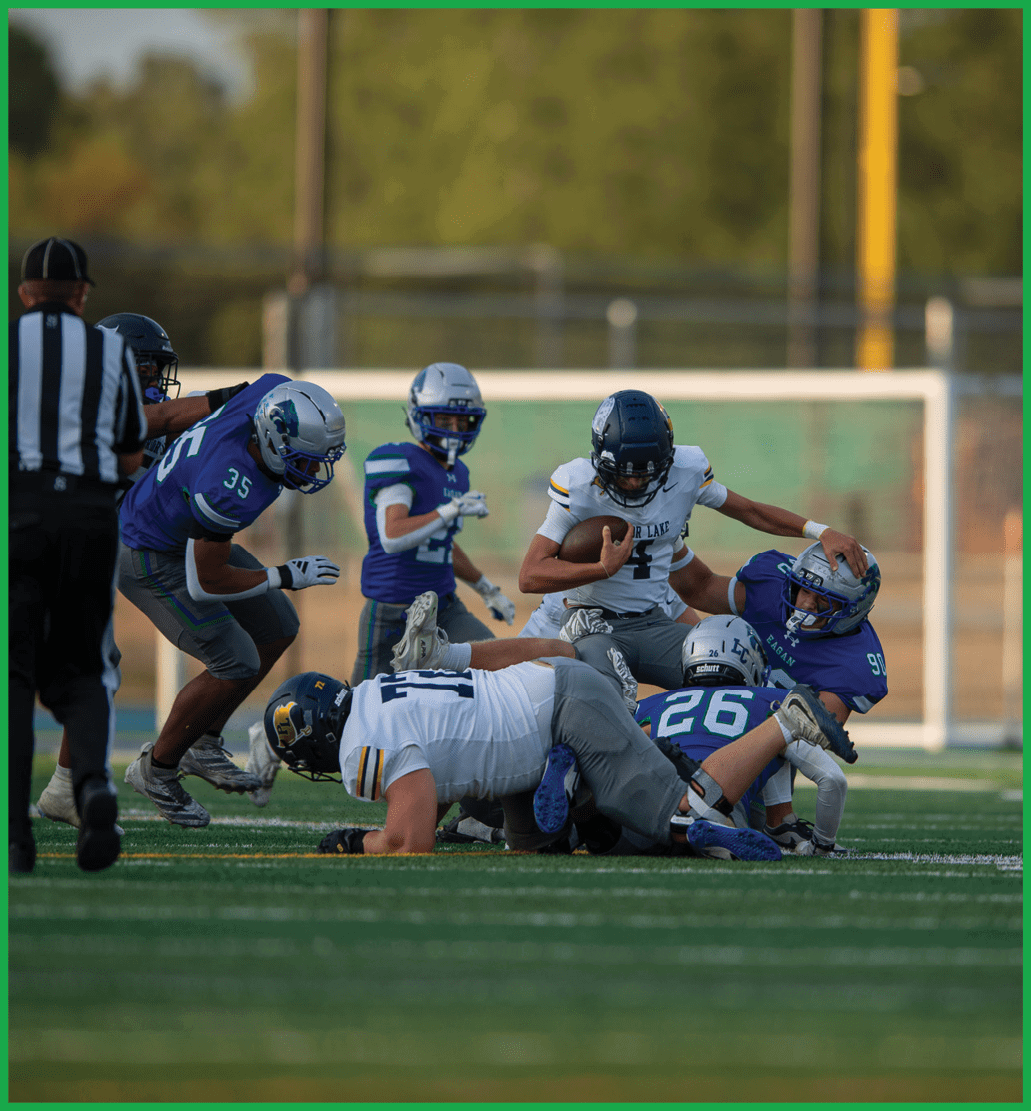A football player running on the field. Description generated by AI