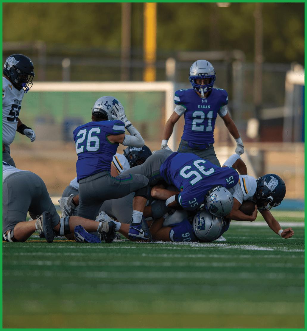 A football player running on the field. Description generated by AI
