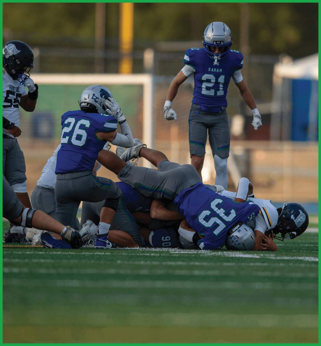A football player running on the field. Description generated by AI